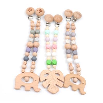 China Soft Pram Garland Toys Baby Safe Organic Beech Leaf Silicone Teething Stroller Clip Chain for sale