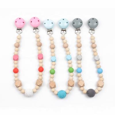 China Soft Toy Baby Wooden Stroller Garland Toy Silicone Molar Stroller Stroller Dangling Pacifier Chain for sale