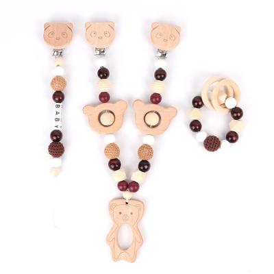 China Toy Food Grade Wooden Baby Soft Teether Set Safe Baby Chew Toys Cart Chain Pacifier Chain Bracelet Set for sale