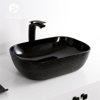 China Modern Hot Selling No Hole Crocodile Pattern Bathroom Sink Table Top Black Wash Basin for sale