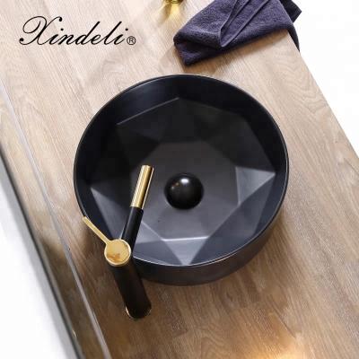 China Modern Unique Design Matte Black Color Over Counter Wash Ceramic Art Basin for sale