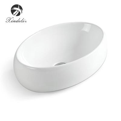 China Modern Interesting White Ceramic Bathroom Basin Sink Table Top Decorative Porcelain Price Basin for sale