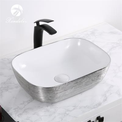 China Modern New Design XDL-D1333H131 Color Wash Basin White And Silver Plated Ceramic Sink for sale