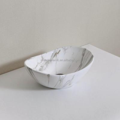 China Modern Marble Oval Porcelain Sink Bathroom Vessel Sink Ceramic Sink for sale