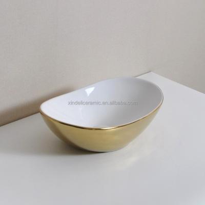 China New Modern Stylish Bathroom Sink Ceramic Gold Plating Gold Wash Basin for sale