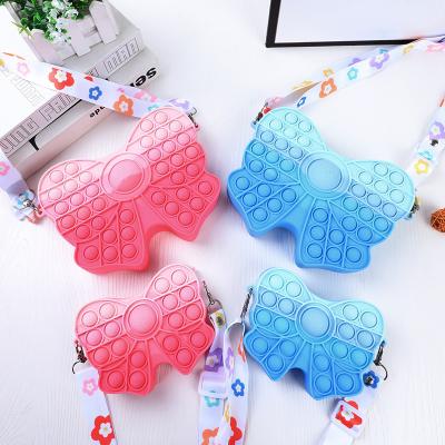 China Cute Fashion Silicone Purses and Purses Pop Bowknot Purse for Girl Women Bowknot Shoulder Bag with Adjustable Strap Busy Sensory Toy for sale