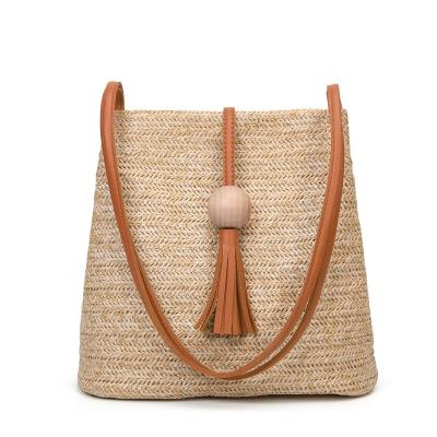 China Fashionable Bucket Straw Beach Bag Woven Women Summer Beach Bag Tassel Bag for sale