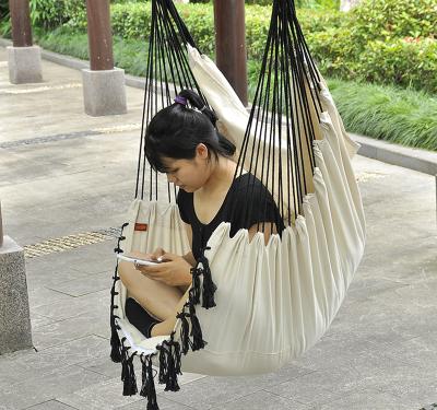 China Pirny Foldable Hot Sale Hanging Chair Black and White Fringe Swing Outdoor Chair with Wooden Bar Cotton Canvas Swing for sale