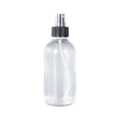 China Pharmaceutical Empty Clear Glass Round Boston Spray Glass Bottle With Dropper Bakelite Cap Spray Press Pump Cover for sale