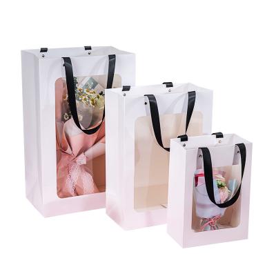 China Recyclable Custom Gift Bags Valentine's Day Gift Bag Transparent Flower Logo Shopping Bag for sale