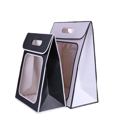 China Recycled materials wholesale flowers gift bag paper bags custom wedding clothing shopping bag for sale