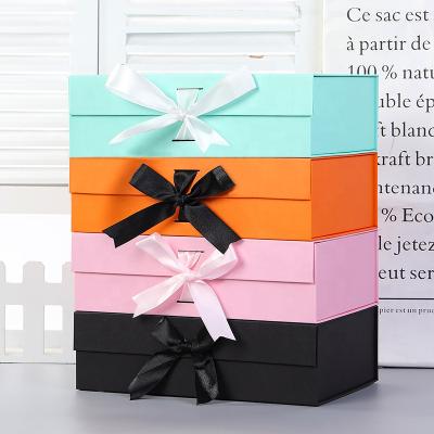 China Recyclable Cheap Price Magnetic Gift Folding Paper Box With Ribbon for sale