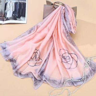 China New design 180*90cm simple dyed pink flower printed silk satin women hijab scarves with different color edges for sale