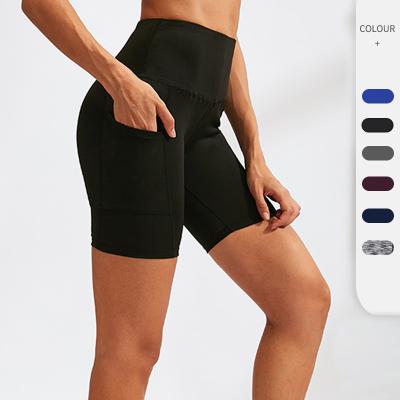 China Breathable Quick Dry Tight Elastic Training Fitness Shorts Women's Yoga Shorts With Pockets for sale