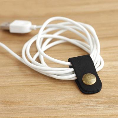 China Promotion gift kq107 high quality genuine leather earphone cable winder for sale