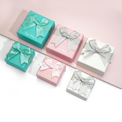 China Eco-friendly Sliver Bow New Arrival Custom Jewelry Set Earrings Ring Pendant Jewelry Packaging Box With Logo for sale