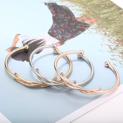 China Fashion Couples Bracelet Winding Intertwined Design Stainless Steel Women Three Color Simple Stretch Cuff Bracelet for sale