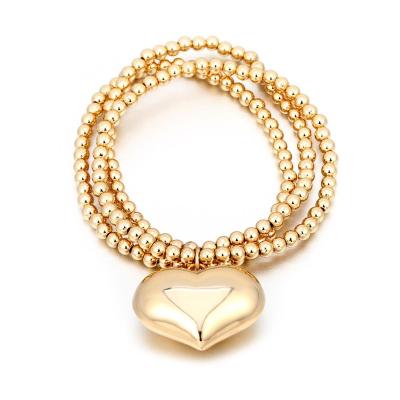 China Fashion Gold Heart Bell Charm Big Bead Bangle Women Girl Silver Fashion Jewelry Party Gifts Elastic Bracelets for sale