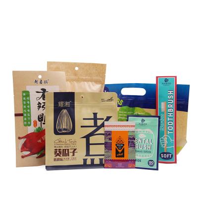 China Barrier wholesale doypack aluminum foil food packaging vertical kraft paper bag with windows for sale