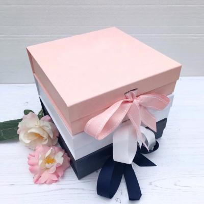 China Wholesale Recyclable Custom Art Paper Cardboard Magnetic Flip Foldable Book Shape Gift Box With Ribbon for sale