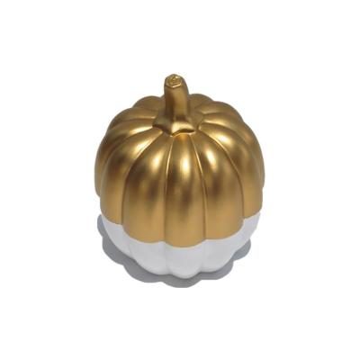 China Cheap Cute Modeling Handmade Ceramic Decoration Africa White And Gold Pumpkin Ceramic Halloween Decorations for sale