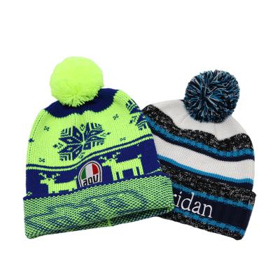 China JOINT Jacquard Knit Winter Logo Beanie Hats Pom Pom Knitted Flip Cap Custom for sale