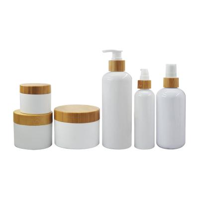 China 8oz Cosmetic Empty Facial Cream Jars Containers Set White PET Cosmetic Packing Shampoo Plastic Bamboo Bottle for sale