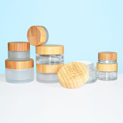 China Clear Cosmetic 50g Glass Jar With Bamboo Cap For Eyeshadow Hand Cream Packaging for sale