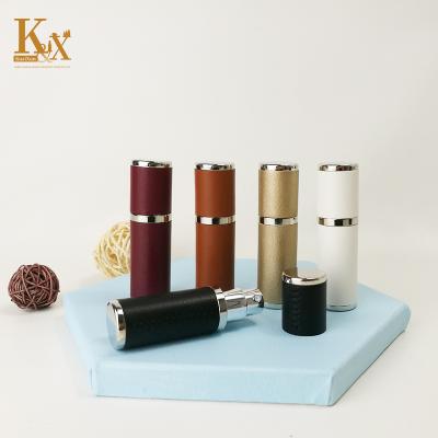 China Personal Care Custom PU Perfume Round Atomizer Mini Travel Spray Luxury Pocket Refillable Leather Bottle With Paper Box for sale