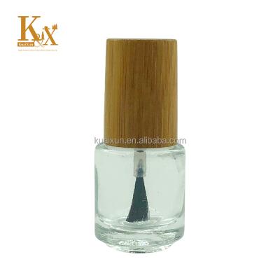 China Personal Care Round Shaped Nail Polish Bottle 15ml Glass Empty Bottle With Wooden Cap And Bamboo Lid Brush for sale