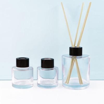 China 200ml Aromatherapy Cosmetic Decorative Bottle With Cap Around Shaped Clear Glass Reed Diffuser Car Room Diffuser Bottle for sale