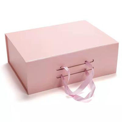 Κίνα Luxury design pink folding magnetic paper cardboard gift box jewelry packaging custom gift box with ribbon προς πώληση