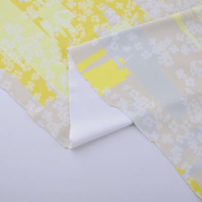 China Chinese Suppliers Waterproof Polyester Spandex Fabrics For Dresses Polyester Jacquard Fabric For Dress Daisy Printed Fabric Yellow for sale