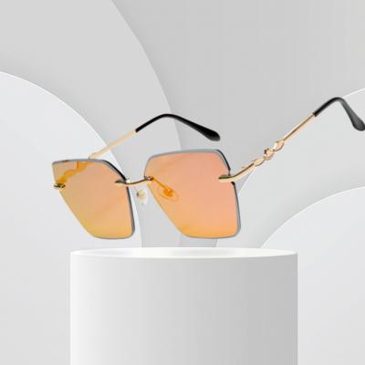 China Fashion Sunglasses Italy Design Rimless Square Glass Sunglasses New Retro 2022 High Quality Women's Stylish Sun Glasses UV400 for sale