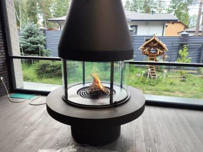 China Muebles de lujo de estilo europeo de alta calidad negro moderno de acero al carbono mesa redonda de vidrio arte chimenea giratoria en venta