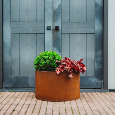 China Decorative Metal Circular Flower Planters Corten Steel Cylinder Garden Pots for sale