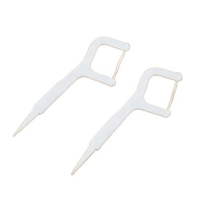 China Dental Cheap Teeth Flosser Dental Flosser Toothpick Cleaning Eco-Friendly Flossers Effectively Bag Package Kraft Paper Bag UHMW Floss for sale