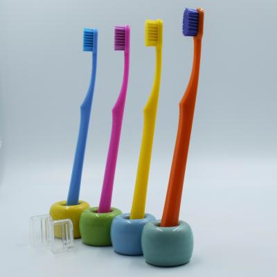 China Manual Colored Handle With 0.10mm Ultra Soft Bristle Adult Toothbrush for sale