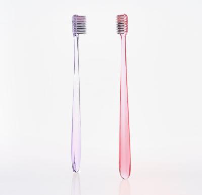 China Japan Market Manual Head Small Transparent Handle With Colorful Bristle Tapered Adult Toothbrush for sale