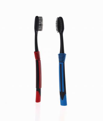 China Tapered Manual Black Charcoal Bristle Adult Toothbrush for sale