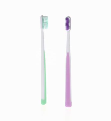 China Manual Slender Head Colored Tapered Stiffens Adult Toothbrush for sale