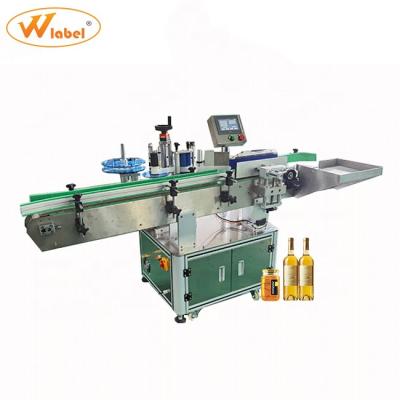 China 2021 Food Most Spicy Automatic High Speed ​​Roller Round Bottle Vertical Chain Application Equipment Labeling Machine for sale