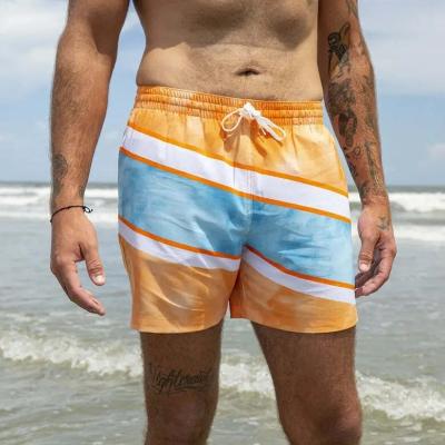 China Custom Plus Size Printed Orange Surf Panel Shorts Coconut Pattern Mens Gym Shorts Recycled Fabric Shorts For Mens Beach for sale