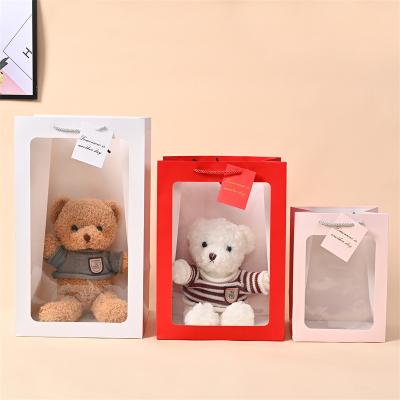 China Quality Eco-friendly Custom Supplier China Hot Selling Transparent Window Design With Extended Hand Strap Birthday Paper Bag for sale