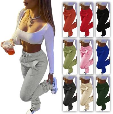 China QUICK DRY women's sweatershirt thickened fabric sports women casual pants drawstring piled pants set with pocket for sale