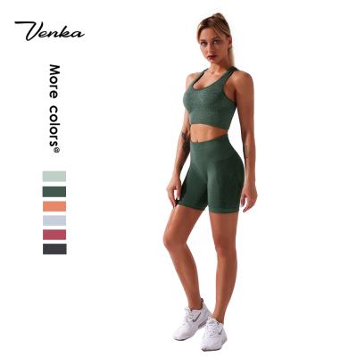 China 2021 Newest Design Antibacterial Seamless Hip Lifting Shorts Yoga Set Women Fitness Yoga Bra Top Seamless Yoga Set for sale