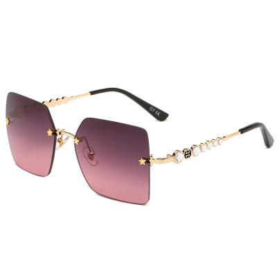 China Fashion Sunglasses 2021 High Quality Rimless Trendy Square Women Sunglasses Gradient Sun Lenses Star Shiny Design Beautify Temples 5020 for sale