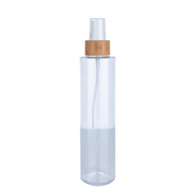 China 220 ml transparente zylindrische klare Flasche mit weißem Spray für kosmetische Bambusflaschen zu verkaufen