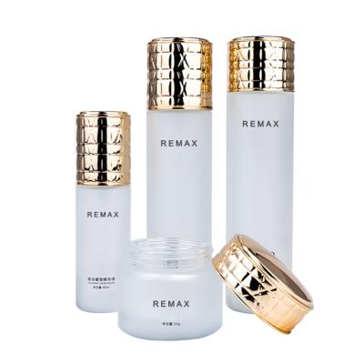 China 50g/40ml/100ml/120ml white Frosted Glass cylindrical bottle with Golden Lid for cosmetic packaging bottle for sale