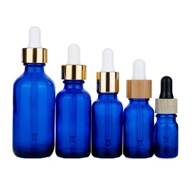 Chine Bouteilles à goutte à goutte en verre bleu de 25 ml et 60 ml Bouteilles à goutte à goutte de 30 ml avec pipette à vendre